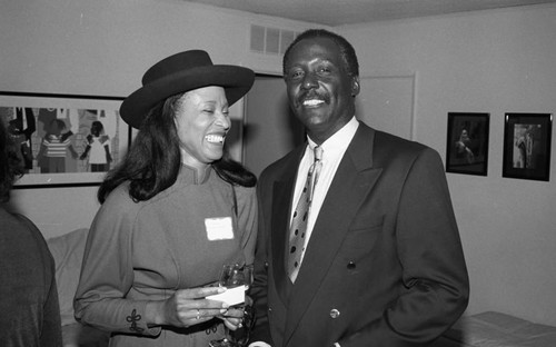 Richard Roundtree talking with a guest at the Friends of Drew Society launch party, Los Angeles, 1993