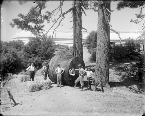 Six men moving a large water tank, Mount Wilson Observatory