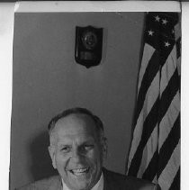 Goodwin Knight, Governor of California from 1953-1959. Portrait at desk with American flag behind him