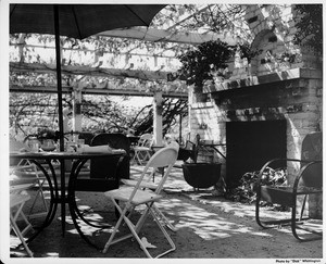 Residential Home in 1948, backyard, patio with fireplace, patio furniture