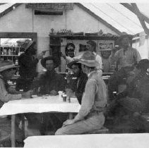 Interior, Stovepipe, Cal. Biggs' crew. Scotty at right. 1907