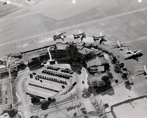 Lockheed Air Terminal with a ramp full of DC-3s, aerial view
