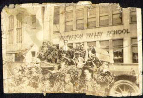 [Group of school kids posing in front of Visitacion Valley school]