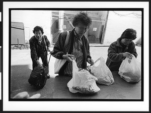 Three Women of Chinese origin at Cameron House food distribution, Chinatown, San Francisco, California, 2002
