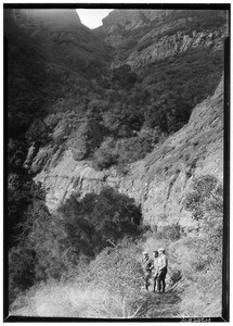 Sequit Canyon, Malibu District, showing three men on a trail, January 14, 1928