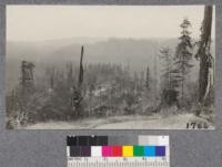 A typical farm in the redwood cut-over region, on top of ridge where clearing is least difficult. View shows Big River Valley in background, looking north from highway. August, 1921
