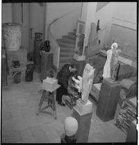 [Artist / sculptor Henri Edouard Navarre in large sculpture studio]