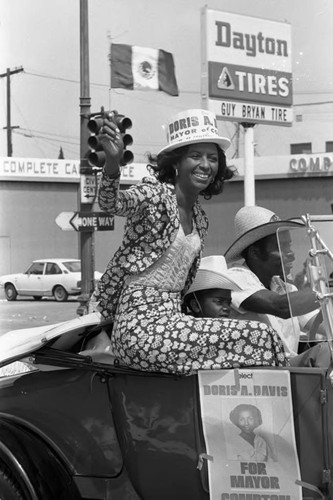 Cinco de Mayo parade participant Doris A. Davis riding in convertible, Los Angeles, 1973