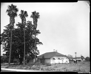 Exterior view of the rear of the Evertsen Adobe, showing for men, July 22, 1960