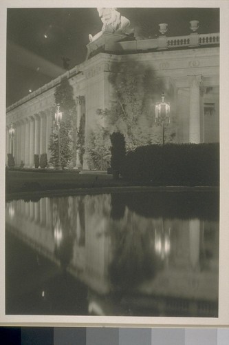 [Court of Four Seasons (Henry Bacon, architect). Colonnade topped with "Feast of the Sacrifice" (Albert Jaegers, sculptor), illuminated.]