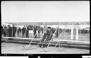 Aviator Philip Orin Parmelee at the controls of a Wright glider at the Dominguez Hills Air Meet, 1912
