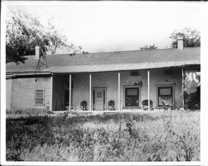 Exterior view of Captain William G. Dana's Nipomo adobe in San Luis Obispo County, showing the covered porch, ca.1900