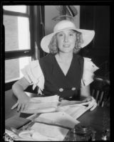 Helen Lee Worthing examing letters, California, 1933