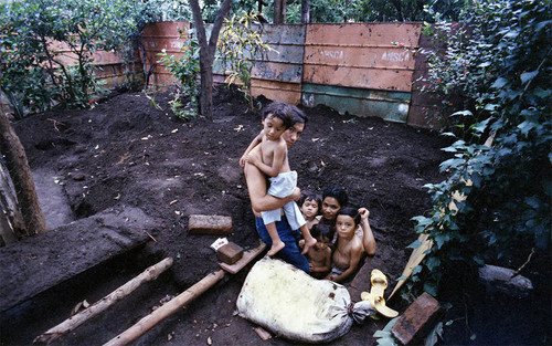 Family in a ditch, Nicaragua, 1979