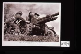 Deadly in action - manhandling a 25-pounder gun into position.[in Arabic]