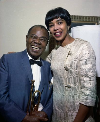 Louis Armstrong is presented with a resolution