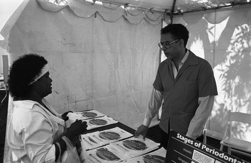 Blacks and Diabetes Awareness Fair participants talking together, Los Angeles, 1989
