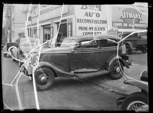 Wrecked two door 1934 Ford sedan, Southern California, 1935