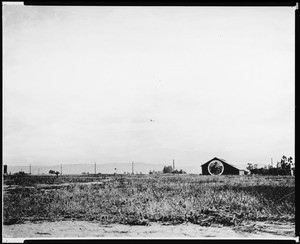 View of an area south of Wilshire Boulevard and Fairfax Avenue looking west, (possibly at Rogers Airport), ca.1920