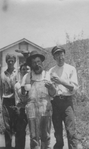 Left to right is Roland Marks, Gene Smith, Manuel Cabral, and Bob Baker photographed after working on wreck of the Loma on July 25, 1906. The "Loma" was given to the Marine Biological Association of San Diego by E.W. Scripps for research purposes; it ran aground near the lighthouse on Point Loma. The Association became the Scripps Institution of Oceanography. July 25, 1906