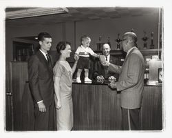Tom Campion opening an account at the Exchange Bank, Santa Rosa, California, 1960