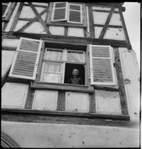 [Elderly couple in war-damaged village home: Emile Schmidt and wife in Ammerschwihr?]