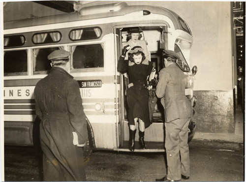 [Passengers exiting a bus at Greyhound terminal on Sansome Street]