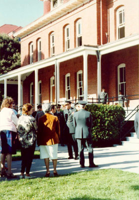 [Group of people gathered outside the Finance & Accounting Office at the Presidio]