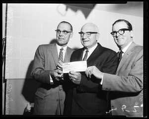 Check for $1,628,550 presented to Mayor, 1958