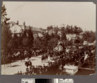 Parade with mountain railway float on Hill Street, Los Angeles