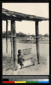 Man seated before loom, French Equatorial Africa, ca.1920-1940