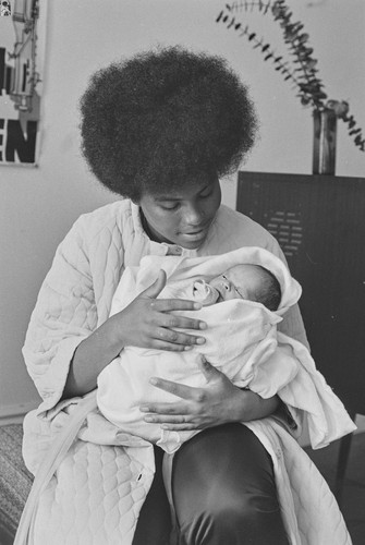 Black Panther mother and her newborn son, Baby Jesus X, San Francisco, CA, #125 from A Photographic Essay on The Black Panthers