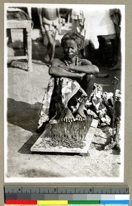 Hindu man sitting on a bed of spikes to seek religious merit, Vārānasi , India, ca. 1920