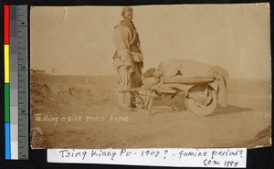 Sick man being transported in a wheelbarrow, China, ca.1905-1910
