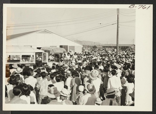 Large crowd assembled to bid bon voyage to residents of Poston who left the project by bus and truck August 24, 1943, for the Rivers center, on the first lap of the journey to Japan via Gripsholm, which sailed from an eastern seaport Sept. 1. Photographer: Brown, Pauline Bates Poston, Arizona