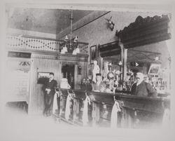 Men behind the bar at the Mercantile saloon on Main Street, Petaluma