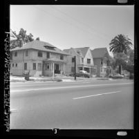 Three houses in African American neighborhood on E Adams Blvd in Los Angeles, Calif., 1962