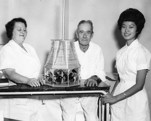 VA Hospital patient L. R. Boatman displays his merry-go-round