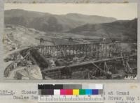 Closer view of construction work at Grand Coulee Dam on east side of Columbia River, May 1937. Metcalf
