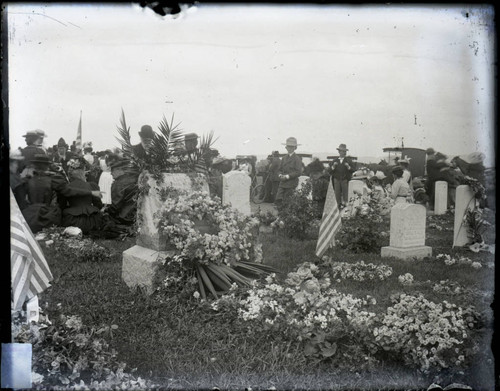 Graves decorted with flowers and flags