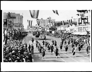 Shiners(?) band marching along Colorado Boulevard in the Pasadena Tournament of Roses Parade, 1925