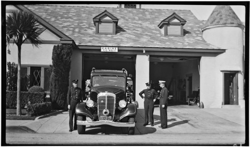 Ahrens-Fox crew with engine outside Station No. 11, 65 E. Market