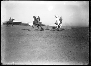 Three equestrians at the Pasadena Tournament of Roses horsemanship contest, 1911