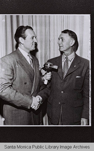 Art Linkletter awards a voucher for an electric dishwasher to Earl Sigourney, Senior Leadman at Douglas Aircraft Company on the CBS "G.E. House Party" radio program in recognition of 10 years and 7 months non-absenteeism