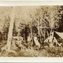 Photographs of Sketches of Western Pioneer Trail scenes. Photograph of a camp in the woods