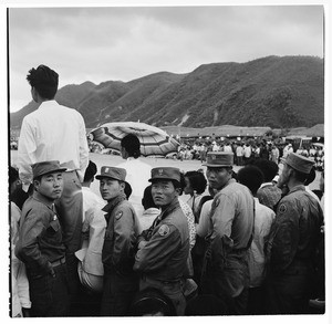 Soldiers among other spectators at an event, Korea