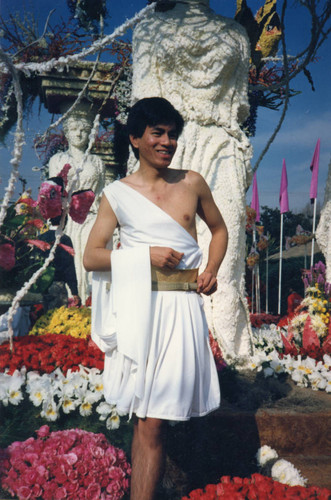Float representative Hung Le posing on the float