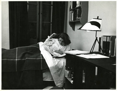Dawn Gardner, Junior at Scripps College, studying in bed