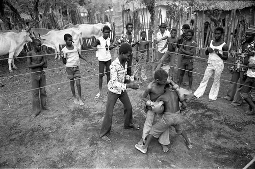 Children boxing in a ring, San Basilio de Palenque, 1977