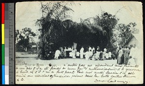 Missionary father conducting religious services in a bower, Congo, ca.1920-1940